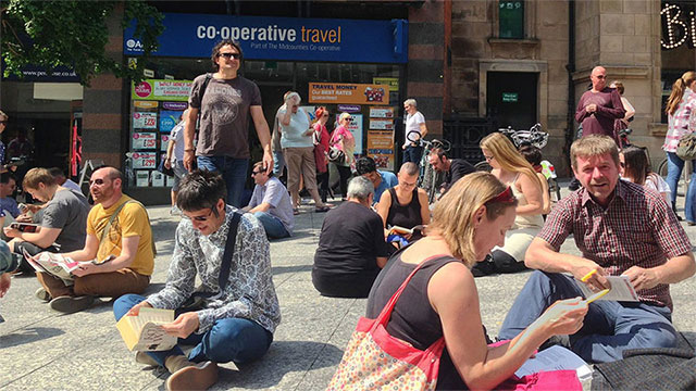 Book reading flashmob at the Brian Clough statue, Nottingham